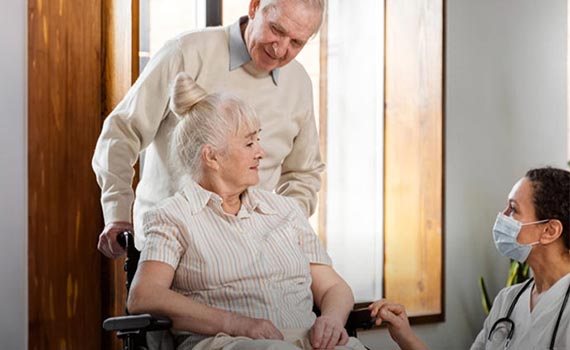 Nurse taking care of old woman