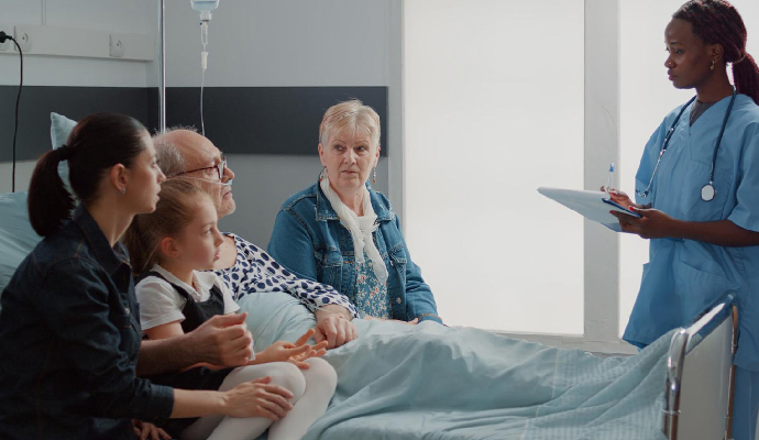 Hospital Ward Specialist is Advising a Nurse on Treatment for a Sick Patient